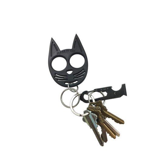 Black cat self-defense keychain attached to a set of house keys