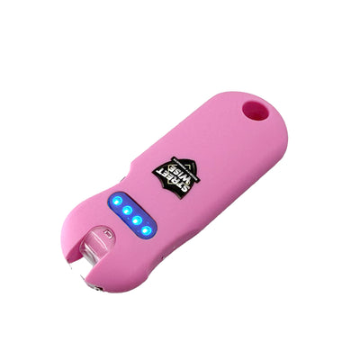 Streetwise rechargeable pink keychain stun gun with blue LED battery indicator lights, compact self-defense design.