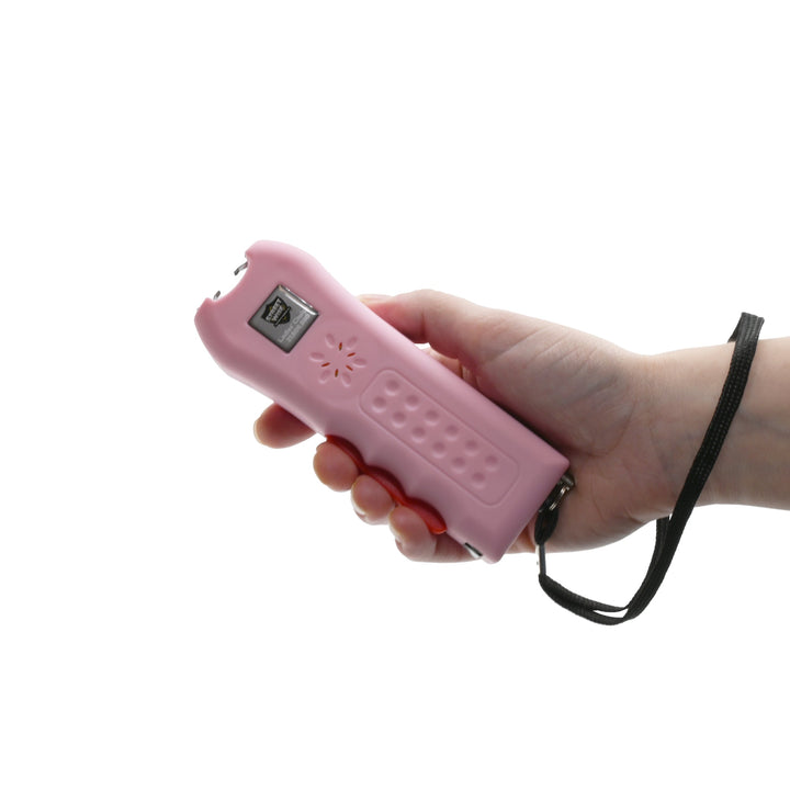 ladies choice stun gun with wrist strap for women in hand