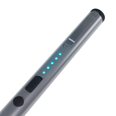 Close-up of silver pen stun gun showing LED battery indicator lights and safety switch