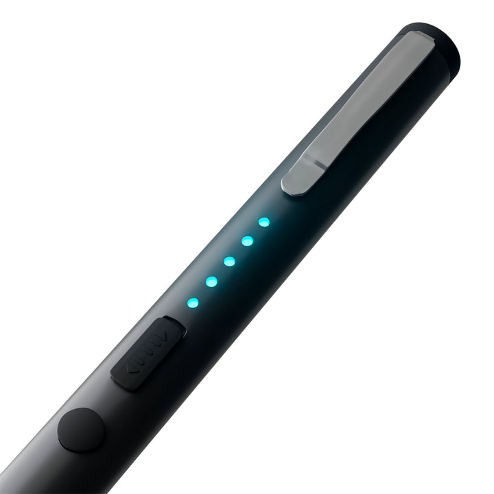 Close-up of pen stun gun showing LED battery indicator lights and safety switch