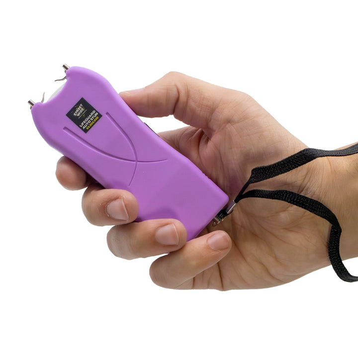 Streetwise light purple Lifeguard Auto Stun Gun shown in hand for scale and grip