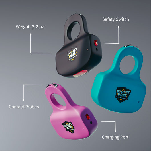 Three Streetwise Sting Ring stun guns in black, pink, and teal showing safety switch, charging port, and contact probes