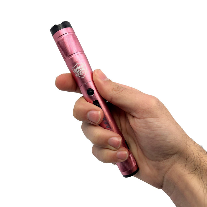 streetwise street light flash light stun gun in hand pink