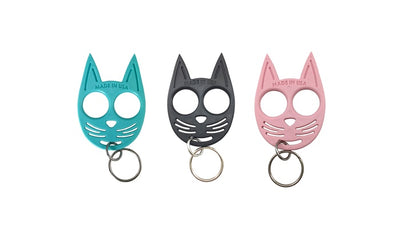 Set of teal, black, and pink cat self-defense keychains with finger grip design