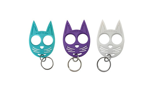 Teal, purple, and white cat-shaped self-defense keychains with key rings